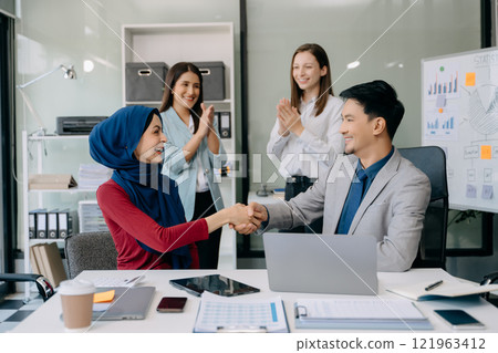 Business partnership handshake concept.Photo Multiracial team coworkers handshaking process.Successful deal after great 121963412