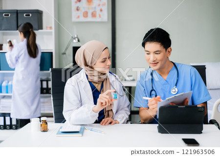 Medical, meeting and laptop for team in discussion, brainstorming and planning. Doctor, nurse on desk show diversity in collaboration, teamwork or workshop Medical, meeting and laptop for team in discussion, brainstorming and planning. Doctor, nurse on desk show diversity in collaboration, teamwork or workshop 121963506