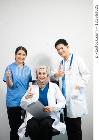 Successful team of medical doctors looking at camera and smiling while standin. Health, professional and people team in white background 121963628