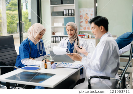 Doctors and nurses working together in a hospital ward, showcasing professionalism, teamwork Doctors and nurses working together in a hospital ward, showcasing professionalism, teamwork 121963711