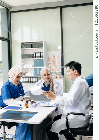 Doctors and nurses working together in a hospital ward, showcasing professionalism, teamwork Doctors and nurses working together in a hospital ward, showcasing professionalism, teamwork 121963890