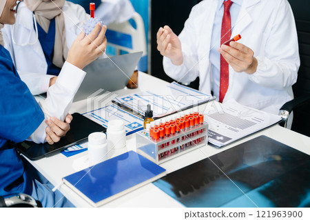Medical technology network team meeting concept. Doctor hand working with smart phone modern digital tablet and laptop computer 121963900