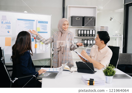 Business team discuss at meeting room. working together with laptop ,tablet and smart phone on desk Financial accountant , planner , meeting in office 121964064