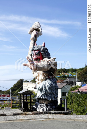 Blue sky and Namahage statue in front of the gate 121965891