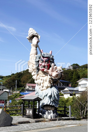 Blue sky and Namahage statue in front of the gate 121965892