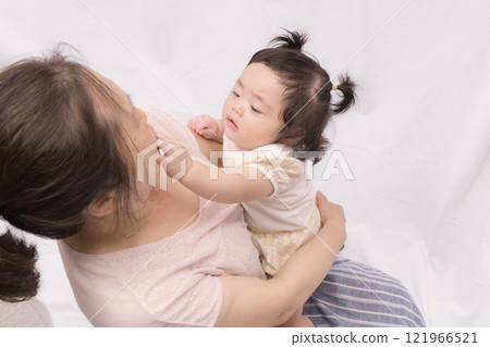Baby touching grandma's face Baby touching grandma's face 121966521