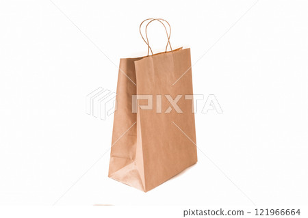 Recycled paper kraft long shopping bag isolated on white background. Recycled paper kraft long shopping bag isolated on white background. 121966664