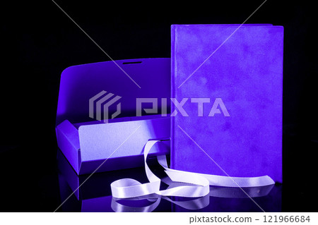 Best gift for men. Man gift concept. Blue notebook with blue gift box on black background. Copy space text. Valentine's day, wedding, birthday and special occasion gift concept. Copy space for text. 121966684