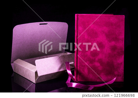 Best gift for men. Man gift concept. Red notebook with open craft gift box on black background. Copy space text. Valentine's day, wedding, birthday and special occasion gift concept. Copy space. 121966698