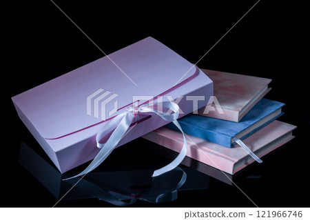 Best gift for men. Man gift concept. Various notebooks with craft gift box black background. Copy space text. Valentine's day, wedding, birthday and special occasion gift concept. Copy space for text. 121966746