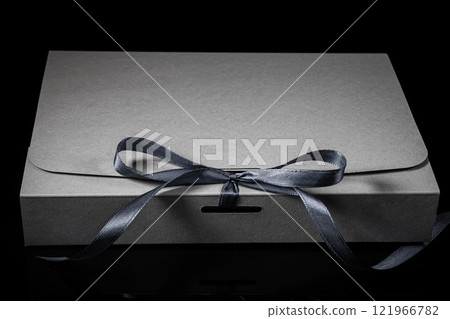 Man gift concept. gift box with luxury bow on dark background. Horizontal with copy space. 121966782