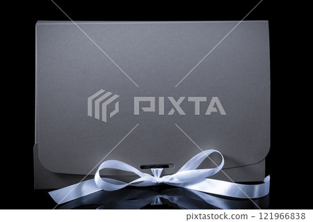 Man gift concept. gift box with luxury bow on dark background. Horizontal with copy space. 121966838