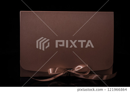 Man gift concept. gift box with luxury bow on dark background. Horizontal with copy space. 121966864