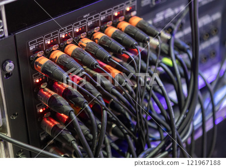 microphone plugs xlr of audio cables plugged into a mixing console or audio interface 121967188
