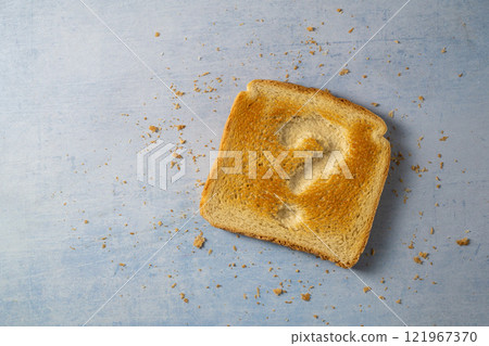 Gluten food, celiac disease, slice of toasted bread with question sign. Gluten sensitivty 121967370