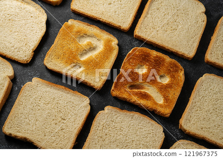 Gluten food, celiac disease, slice of toasted bread with sad face. Gluten sensitivty Gluten food, celiac disease, slice of toasted bread with sad face. Gluten sensitivty 121967375