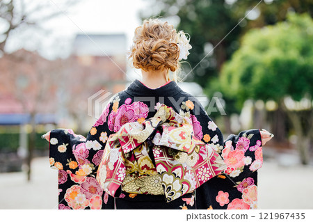 <Coming of Age Ceremony> Back view of a woman wearing a kimono <Coming of Age Ceremony> Back view of a woman wearing a kimono 121967435