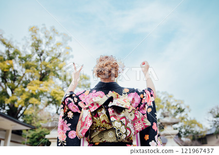 <Coming of Age Ceremony> Back view of a woman wearing a kimono <Coming of Age Ceremony> Back view of a woman wearing a kimono 121967437