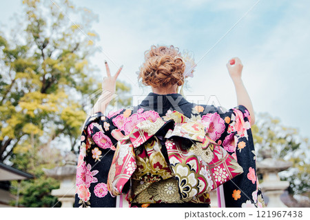 <Coming of Age Ceremony> Back view of a woman wearing a kimono <Coming of Age Ceremony> Back view of a woman wearing a kimono 121967438