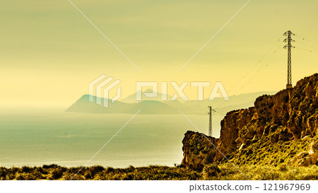 High voltage towers on spanish coast High voltage towers on spanish coast 121967969