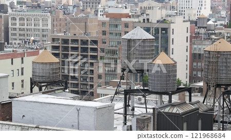 New York City Manhattan cityscape. Rooftop water towers, residential district buildings roof tanks. 121968684