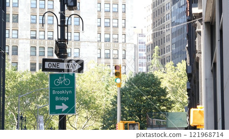 Bike lane road sign, New York City. Brooklyn Bridge bicycle path, cycle route in Manhattan downtown. 121968714
