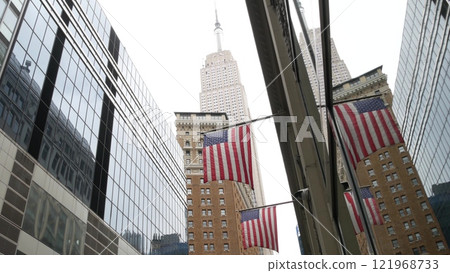New York, american flag. Empire State building. Manhattan midtown city street banner, patriotism. New York, american flag. Empire State building. Manhattan midtown city street banner, patriotism. 121968733
