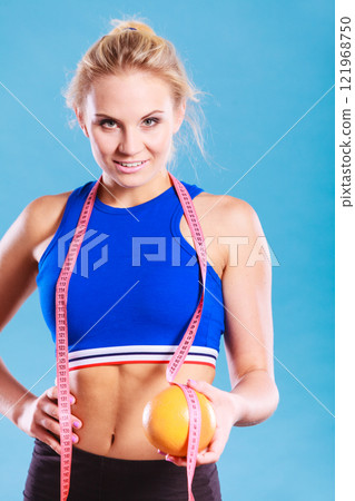 woman fit girl with measure tape and grapefruit woman fit girl with measure tape and grapefruit 121968750