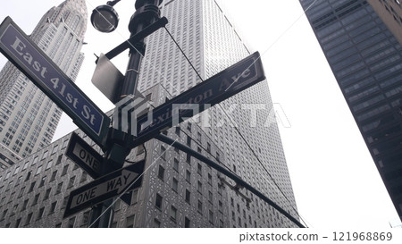 New York City crossroad, street intersection road sign. Chrysler building, Midtown Lexington avenue. 121968869