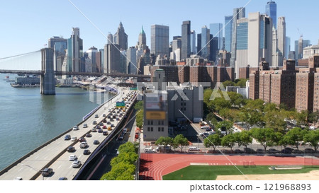 Brooklyn Bridge from Manhattan Bridge. New York City downtown skyline, financial district cityscape. Brooklyn Bridge from Manhattan Bridge. New York City downtown skyline, financial district cityscape. 121968893