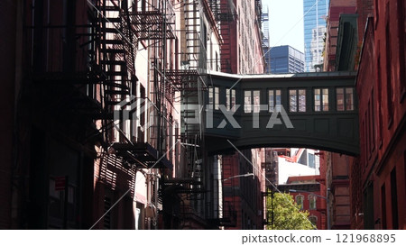 New York City Staple street skybridge. Industrial architecture, red brick building. Manhattan, USA. New York City Staple street skybridge. Industrial architecture, red brick building. Manhattan, USA. 121968895