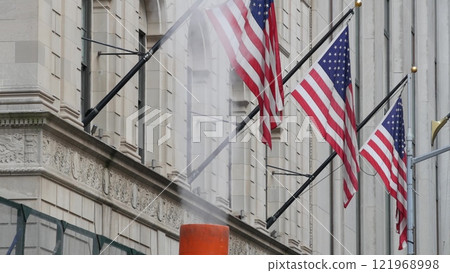 New York Manhattan Downtown Financial District. American USA flag on Wall street near Stock Exchange 121968998