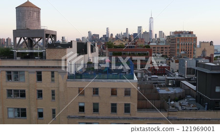 New York City Manhattan downtown skyline cityscape. World Trade Center, rooftop water tower tank. 121969001
