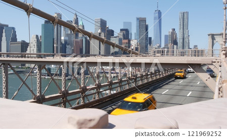 Cars on Brooklyn Bridge. New York City Manhattan skyline, downtown cityscape. World Trade Center. Cars on Brooklyn Bridge. New York City Manhattan skyline, downtown cityscape. World Trade Center. 121969252