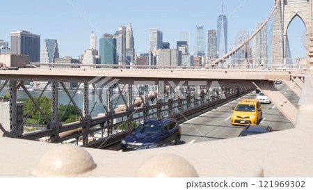 Cars on Brooklyn Bridge. New York City Manhattan skyline, downtown cityscape. World Trade Center. Cars on Brooklyn Bridge. New York City Manhattan skyline, downtown cityscape. World Trade Center. 121969302