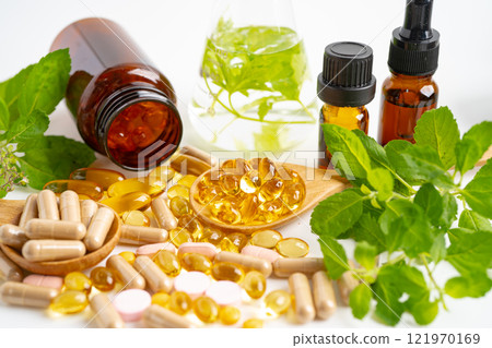 Alternative medicine herbal organic capsule, mineral, drug with herbs leaf natural supplements for healthy good life. Alternative medicine herbal organic capsule, mineral, drug with herbs leaf natural supplements for healthy good life. 121970169