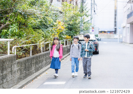Elementary school students going to and from school Elementary school students going to and from school 121972429