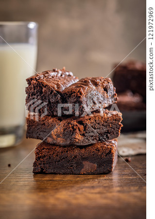 Homemade chocolate brownies on wooden table. Homemade chocolate brownies on wooden table. 121972969