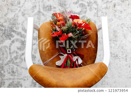 Elegant Bridal Bouquet Resting on a Modern Chair Elegant Bridal Bouquet Resting on a Modern Chair 121973954