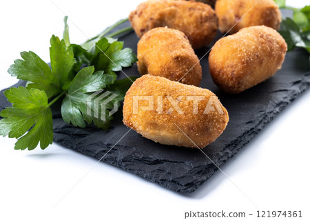 Fried cod croquettes isolated on white background. Traditional spanish food 121974361