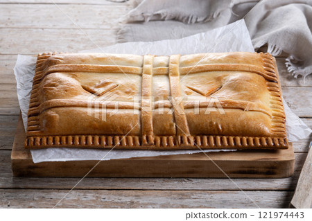 Tuna pie (empanada gallega) on wooden table Tuna pie (empanada gallega) on wooden table 121974443