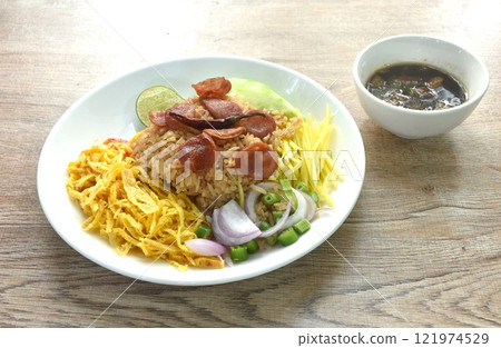 fried rice mixed with shrimp paste eat couple egg and vegetable on plate fried rice mixed with shrimp paste eat couple egg and vegetable on plate 121974529