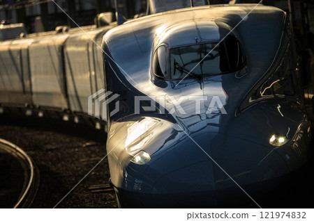 N700 series Shinkansen bathed in the setting sun 121974832