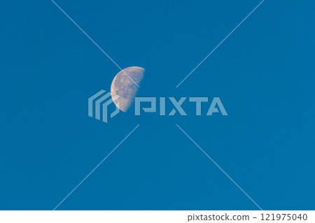 moon floating in the blue sky moon floating in the blue sky 121975040