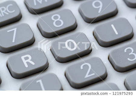 ROI representing Return On Investment letter on calculator button 121975293