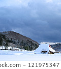 A cute snow-covered mountain hut 121975347