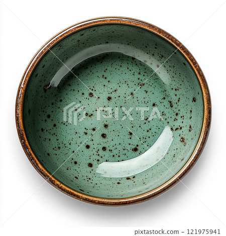 Elegant ceramic bowl with speckled turquoise glaze resting on a white background 121975941