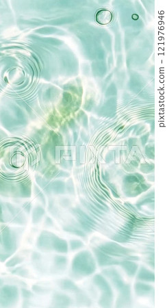 Ripples in clear blue water with abstract circular patterns, suitable as calming SPA background 121976946