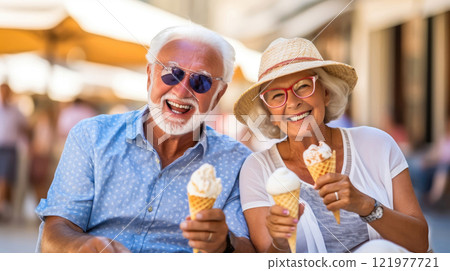 Elderly Couple Delights in Shared Ice Cream Moment 121977721