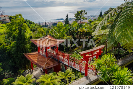 Monte Palace tropical garden with red pagoda, lakes and traditional buildings above the city of Funchal, popular tourist destination in Madeira island, Portugal 121978149